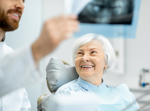 woman being fitted for cosmetic dentures